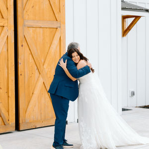 father of the bride with bride at rustic barn wedding venue