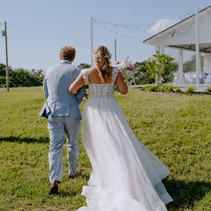 bride and groom portrait at rustic wedding venue