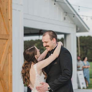bride and groom  at  rustic barn wedding venue