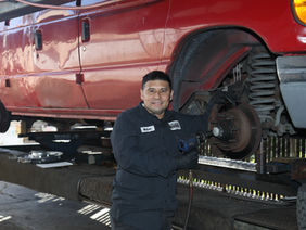 employee working on brakes