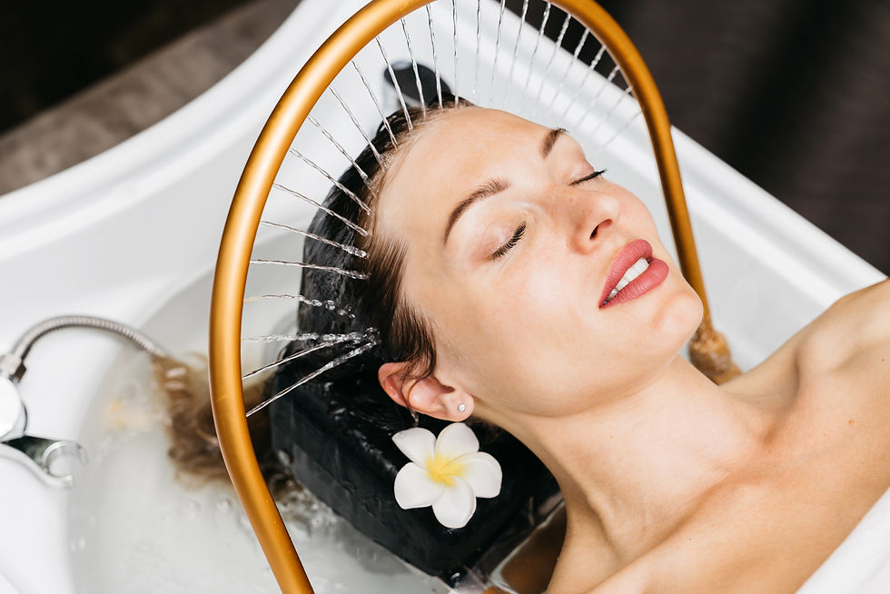 woman getting hydromassage on head