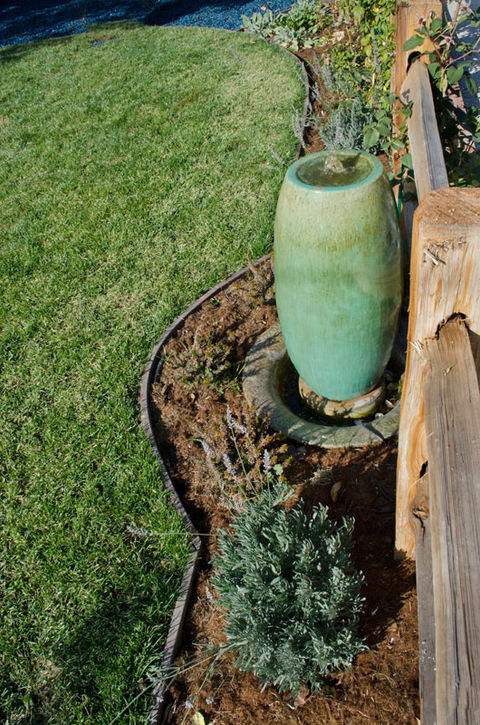 Backyard with bocce ball court and children's playground