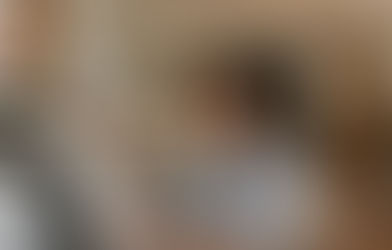 A fashion brand team using digital asset management for retail software on a laptop and tablet to organise seasonal collection assets, product photography, and catalog content through a B2B fashion platform for streamlined order management clothing workflows and tradeshow order booking