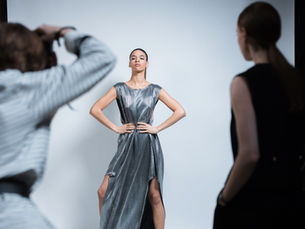Models present dramatic couture gowns during Paris Haute Couture runway show, featuring intricate embroidery, sculptural silhouettes, luxurious fabrics, and handcrafted detailing that showcase the latest luxury fashion trends.