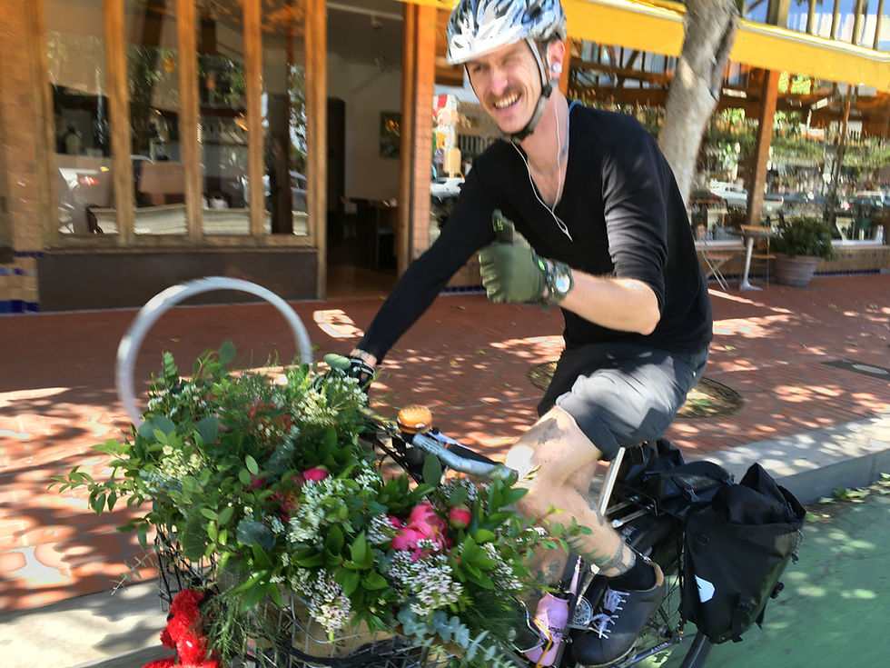 Courier for Farm Girl Flowers. They deliver bouquets all over the city.