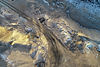 overhead-shot-road-surrounded-by-mountains-agricultural-field-countryside.jpg