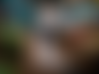 Crowded market scene with vendors and buyers. Fresh produce like tomatoes and greens in baskets. Wet floor, vibrant colors, lively atmosphere.