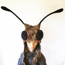 grey raw fleece hat with large bulging fly eyes with bendable antenna