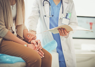 Doctor Holding Patient's Hand