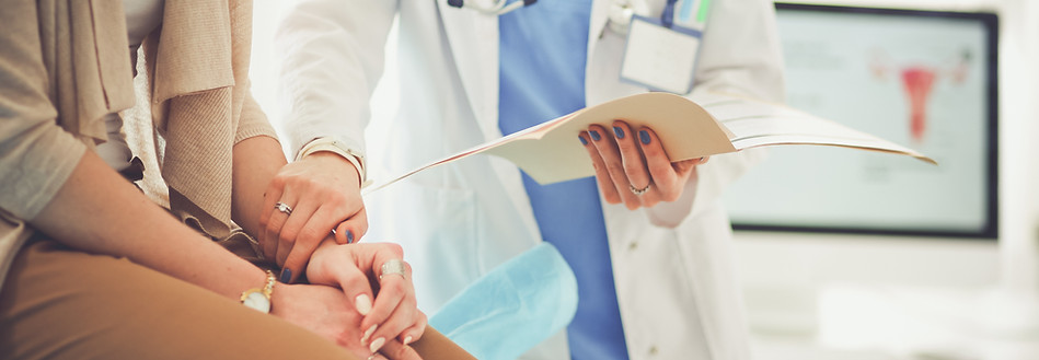 A female patient talks with a doctor