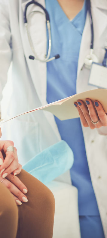 Doctor taking blood pressure of older patient