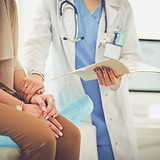 Doctor Holding Patient's Hand