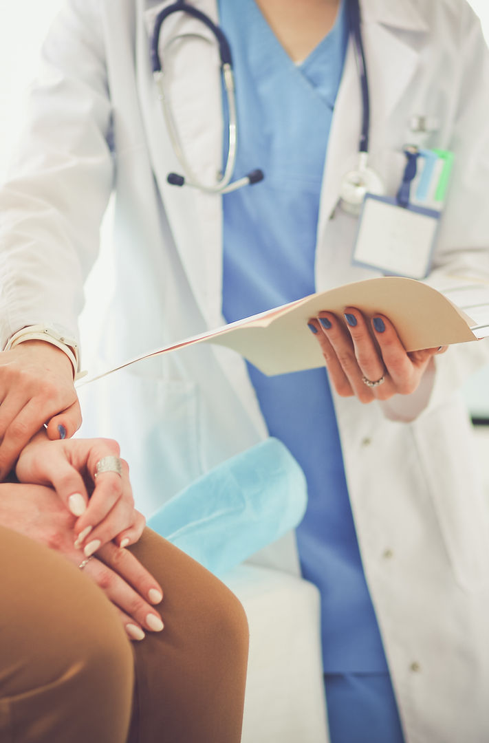 Compassionate doctor holding patient's hand