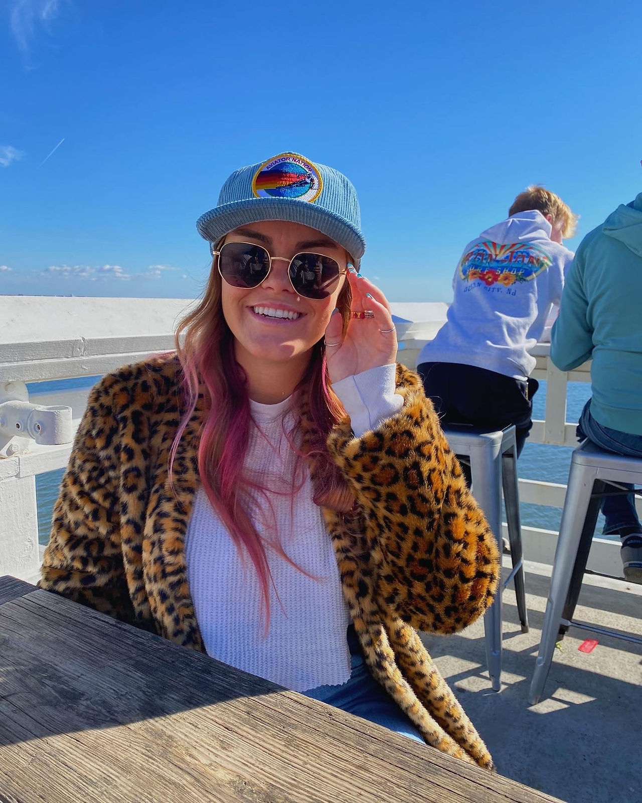 My mom took this photo of me in Malibu eating lunch and it came out super cool, you can see the ocean in the backround.