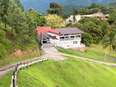 Cloud 9 residence viewed across the sloping lawn at Valli Hai Estate
