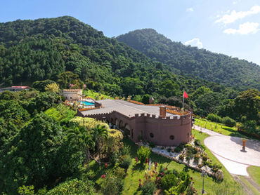 Elevated view of Shandelle Lauren residence against Trinidad’s forested Northern Range