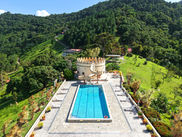 Resort-style pool and terrace at Shandelle Lauren with mountain views