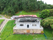 Rear exterior of Cloud 9 residence overlooking the landscaped estate grounds