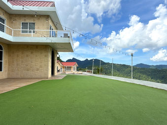 Pool terrace and infinity pool overlooking the Northern Range at The White House