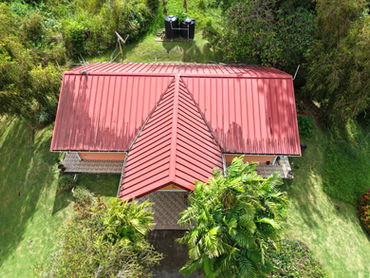 Overhead view of Drogeda’s red roof surrounded by tropical greenery