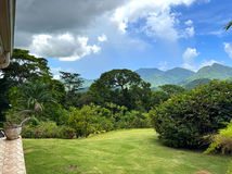 Landscaped lawn and mountain scenery viewed from the grounds of Drogeda