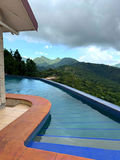 Infinity pool at The White House framed by the surrounding Northern Range