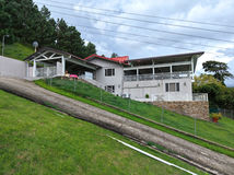 Side exterior of Cloud 9 showing its multi-level design and hillside setting