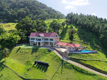 Elevated aerial view of The White House and infinity pool at Valli Hai Estate