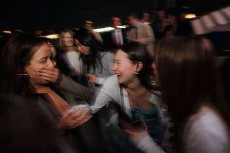 Unique NYC wedding celebration dancing on deck with the skyline lit up