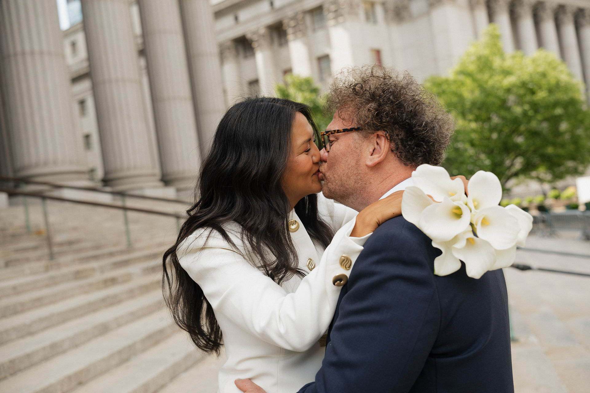 Manhattan City Hall wedding portraits on the courthouse steps and columns