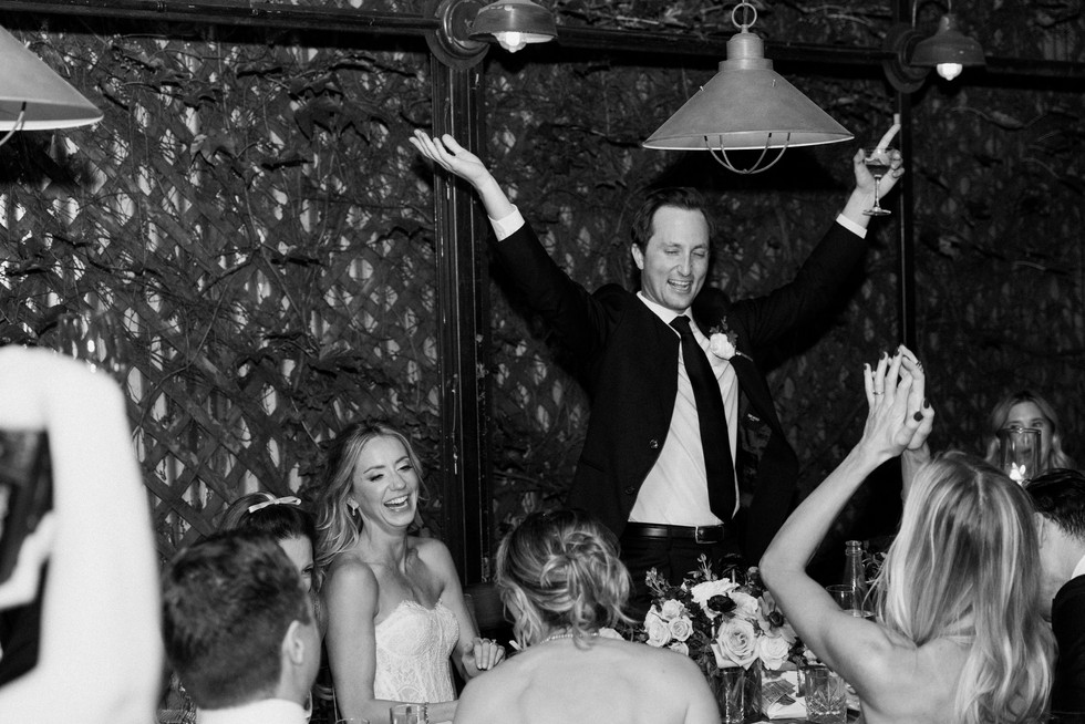 Intimate outdoor dinner setup under string lights at Aurora Brooklyn wedding venue