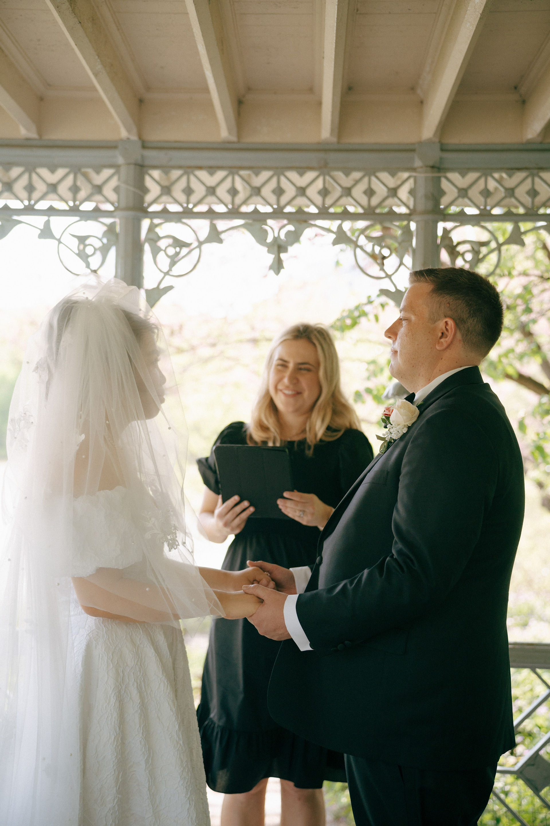 Ladies pavilion central park wedding elopement, bride, groom and officiant under gazebo, cinematic photography, new york elopement photographer