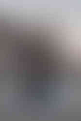 Bride and groom at waterfront in Fulton Ferry Park with Manhattan skyline backdrop, Brooklyn elopement photographer NYC