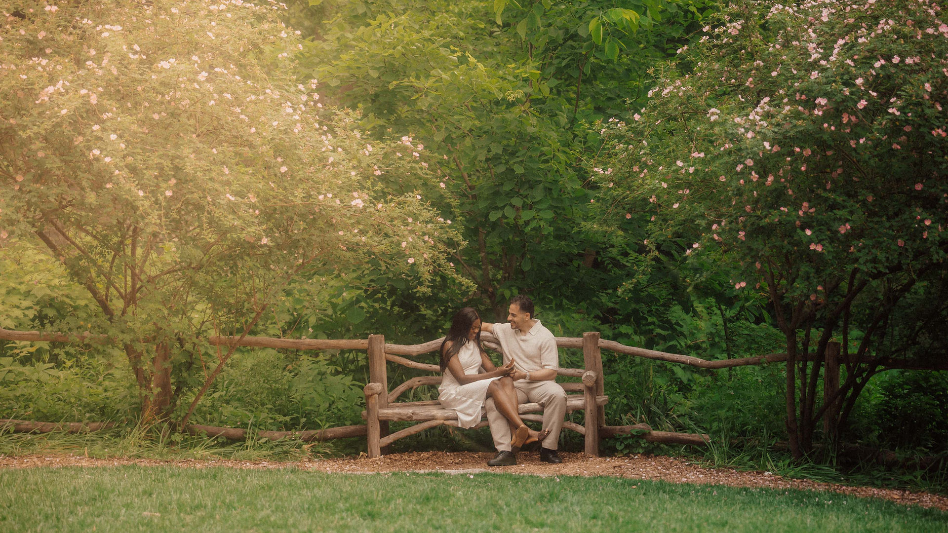 Proposal photography NYC, garden bench engagement portrait