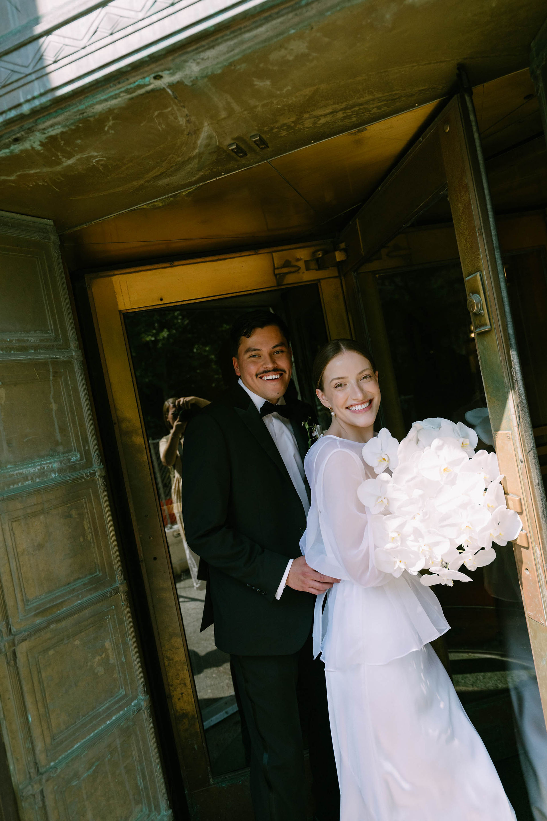 documentary cinematic film frame of a couple entering the Marriage Bureau, NYC courthouse wedding, All The Feels