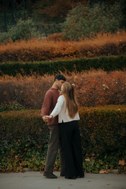 Couple having fun at Conservatory Garden Central Park engagement photos romantic NYC photographer