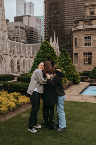 Best Friends hugs with the future wife 620 Loft and Garden Surprise proposal during NYC photoshoot, romantic moment, winter at Rockefeller Center