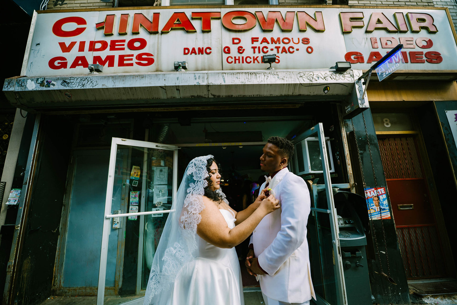 couple dancing outside chinatown famous games nyc elopement candid wedding photographer