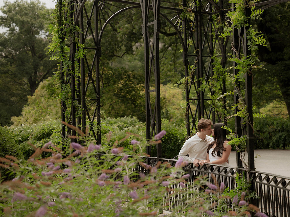 Couple at Conservatory Garden Central Park engagement photos NYC cinematic photographer