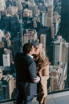 photographer at the Edge surprise proposal overlooking the Manhattan skyline, surprise proposal ideas on rooftops in NYC Hudson Yards photoshoot