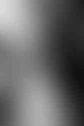 Bride and groom walking hand-in-hand at sunset along Brooklyn waterfront