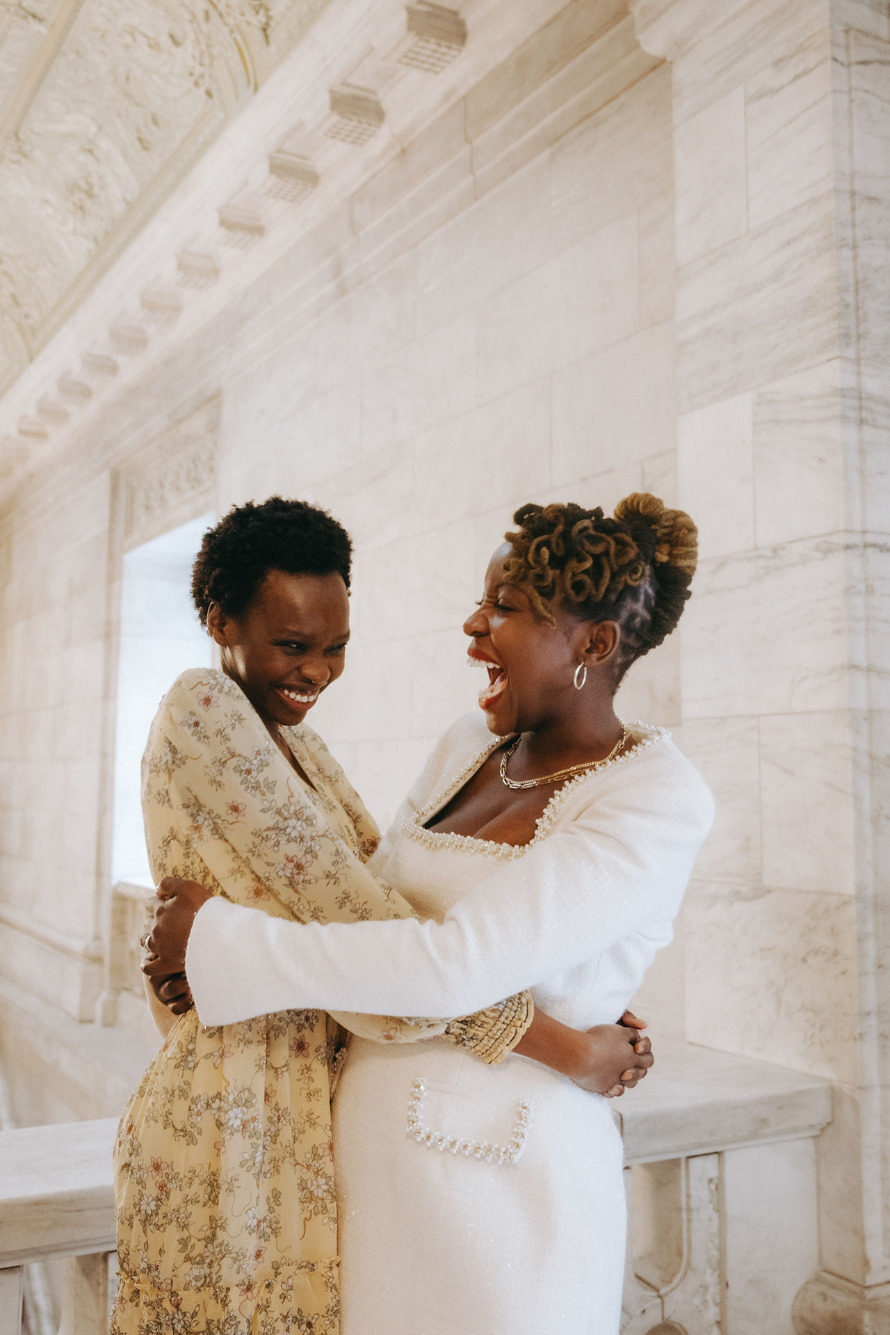 Friendship portrait photoshoot in NYC, two women hugging, bride to be with family portrait, NYPL photo session New York