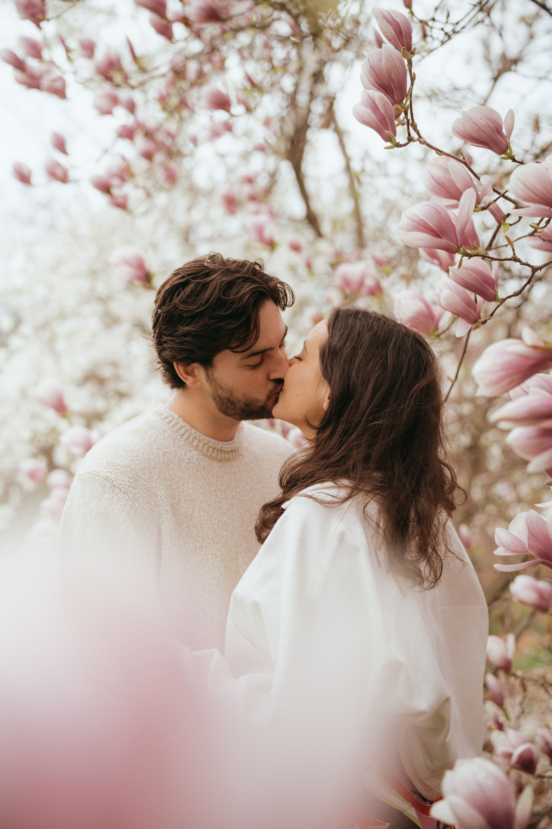 cherry blossom photoshoot in central park with engaged couple