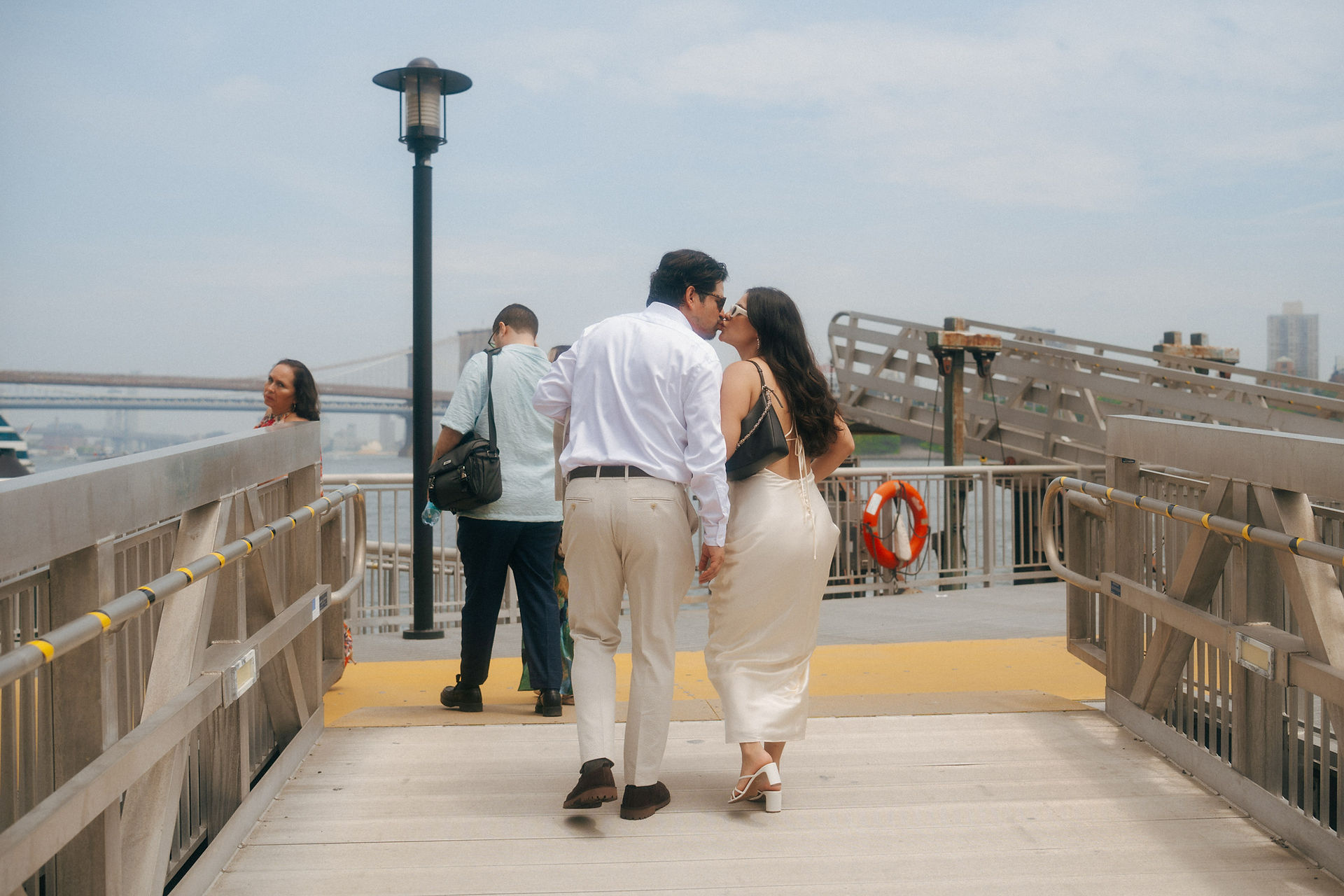 Romantic ferry elopement photos overlooking Manhattan skyline