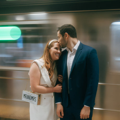 Manhattan City Hall wedding photoshoot in front of subway entrance