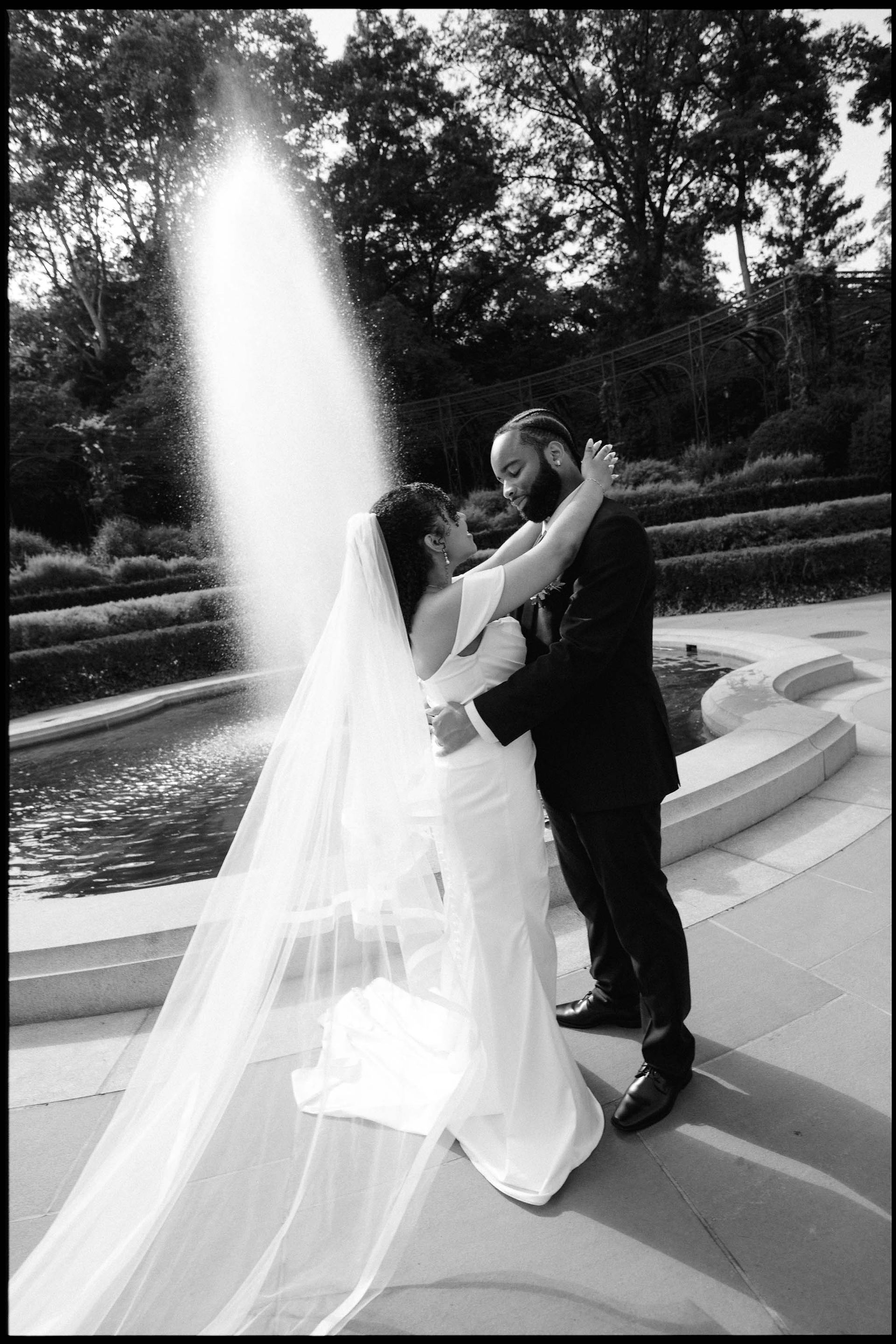 Cinematic black and white wedding portrait of the veil in the breeze, Conservatory Garden, All The Feels
