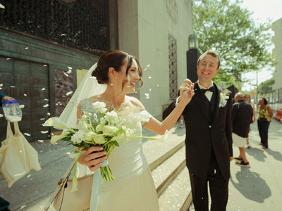 handwritten courthouse wedding vows on folded paper with wedding rings