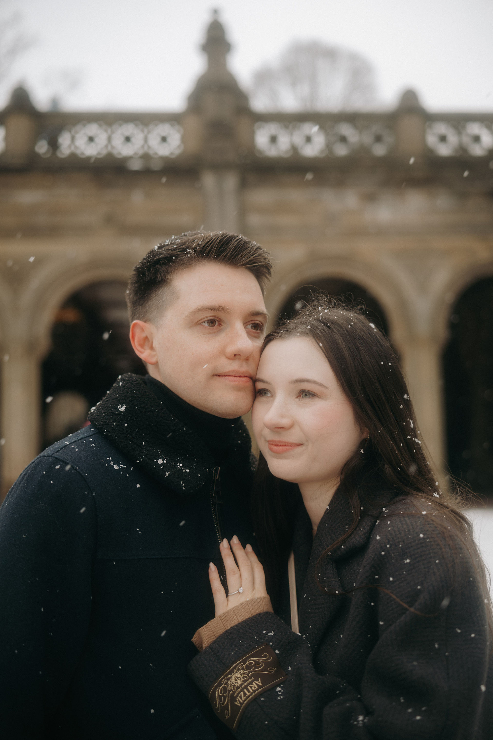 romantic couple portrait central park winter snow at bethesda terrace