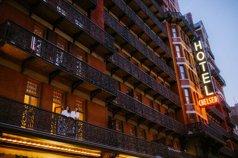 chelsea hotel photoshoot balcony couple nyc neon sign