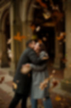 couple during fall engagement photos under peak fall colors in Central Park